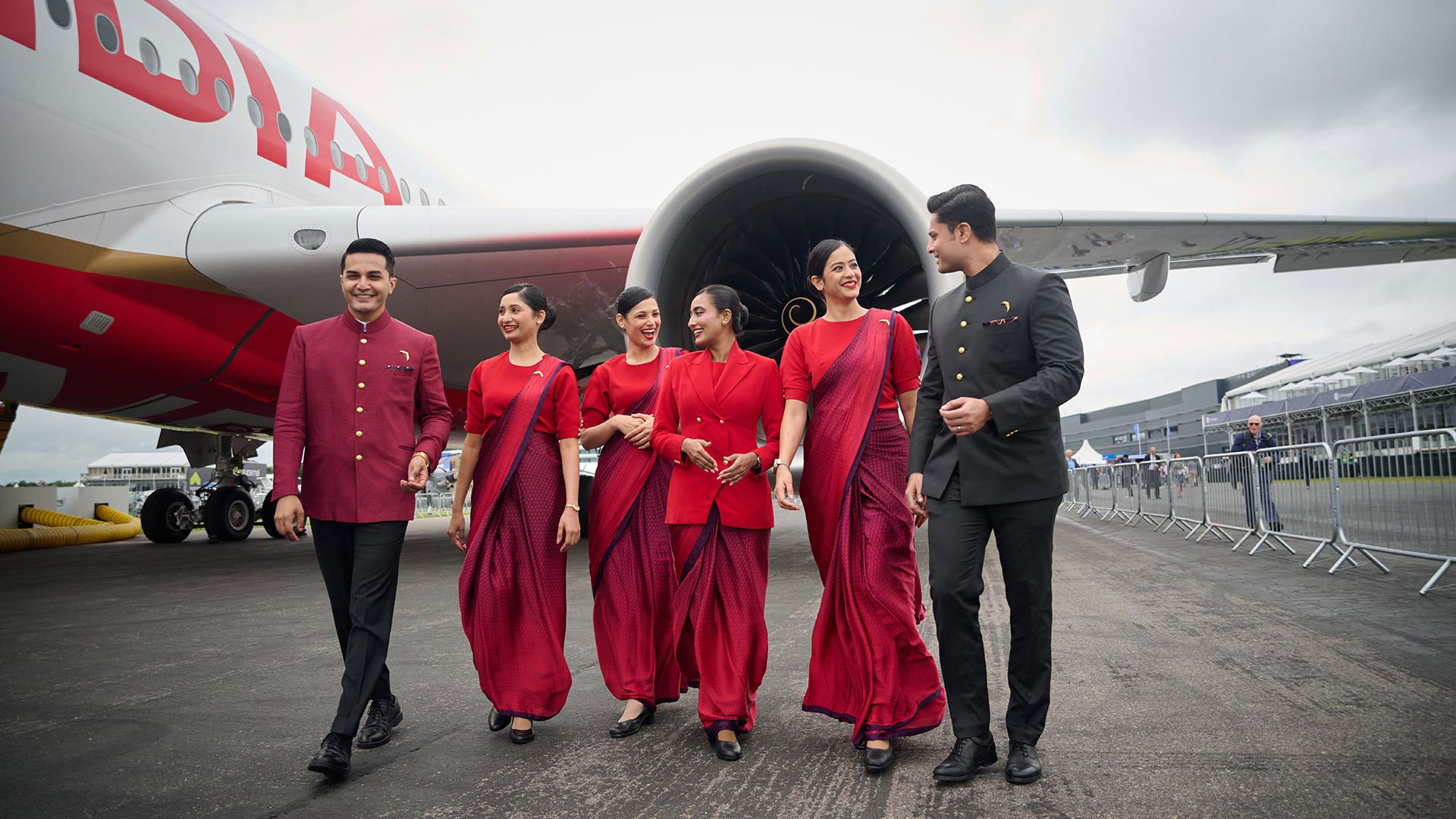 Air India staff in front of the engine of the A350