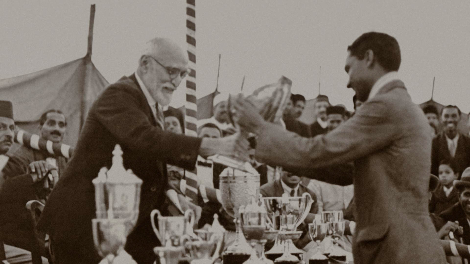 An undated photo of Sir Dorabji handing awards to athletes