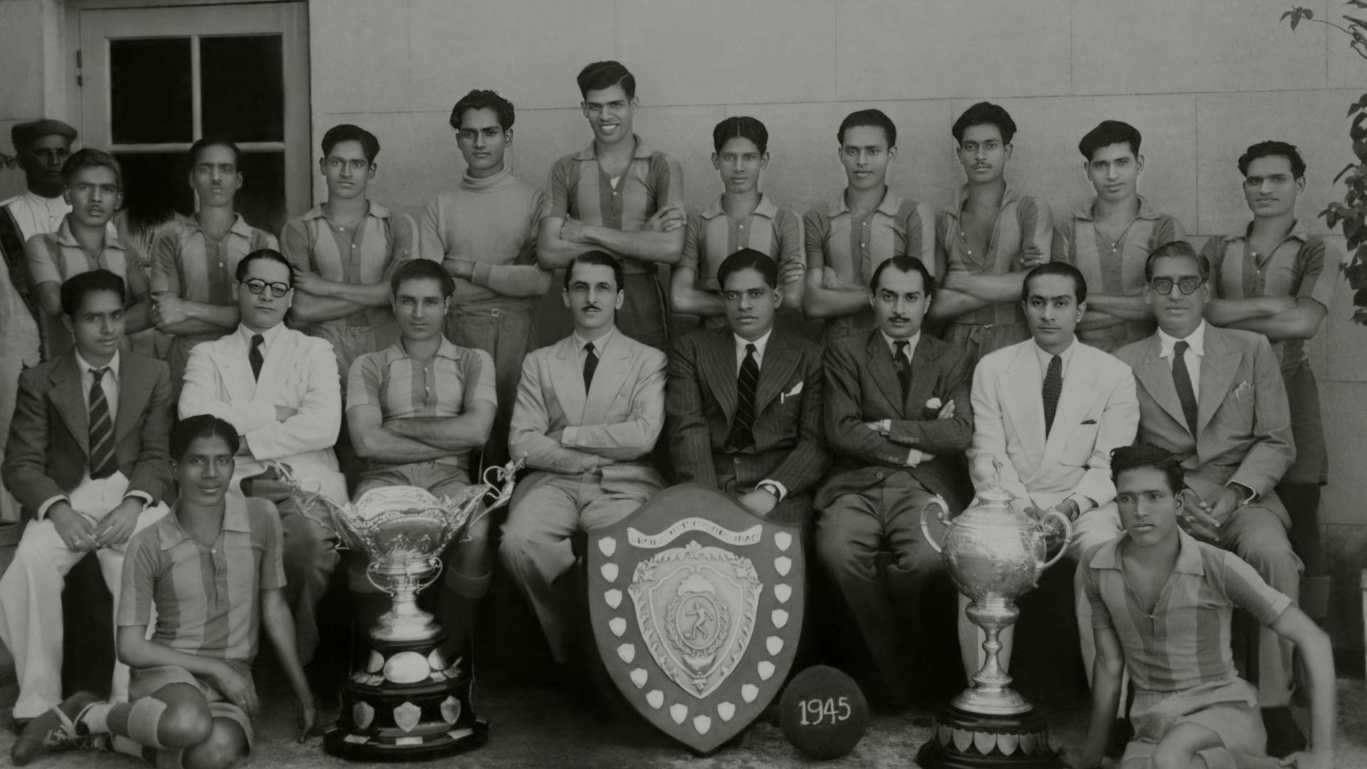 Photo of JRD with the Tata Sports Club team. The team won the Times of India championship in 1964