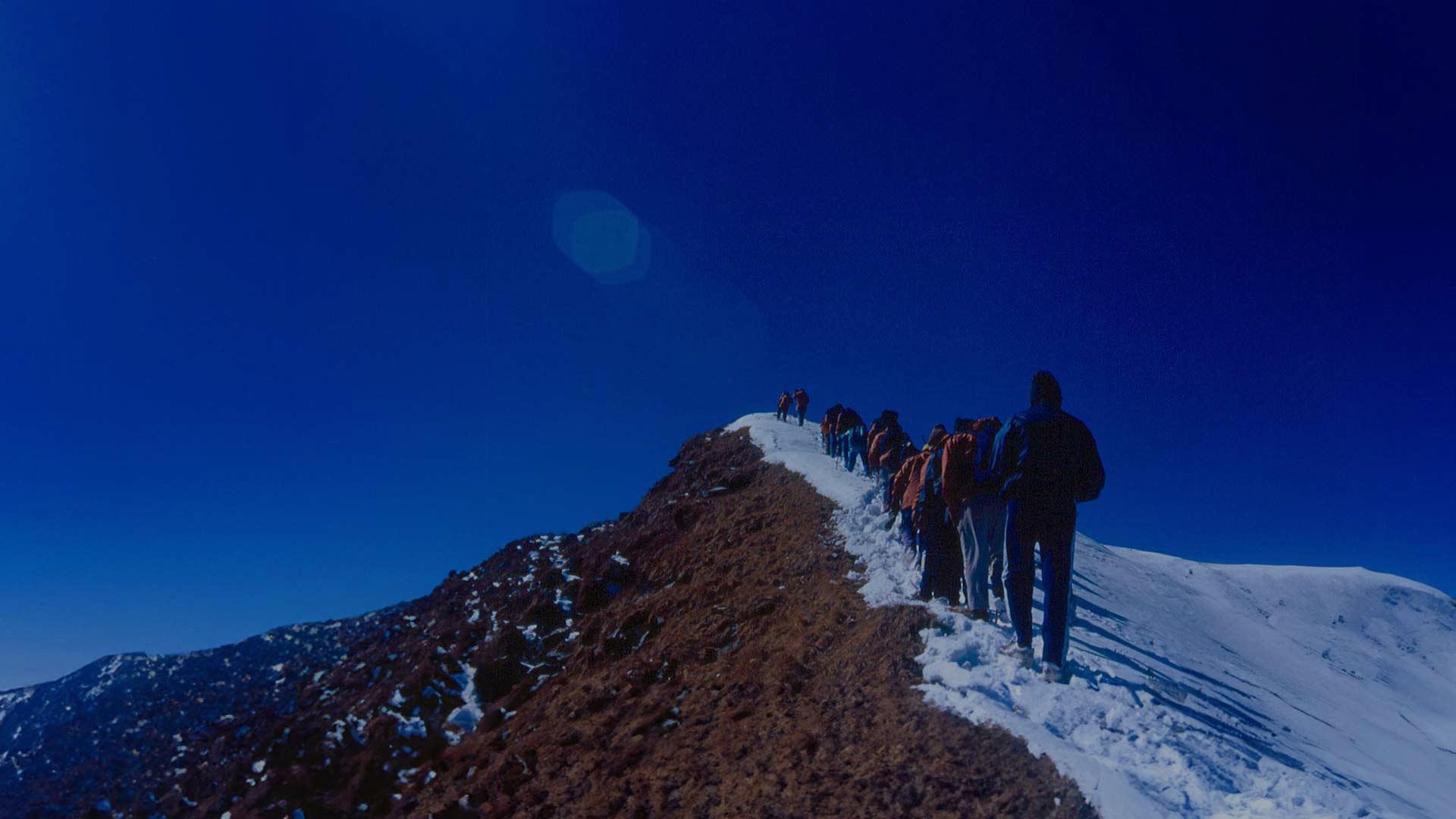 Mountain climbers from TASF at a mountain peak