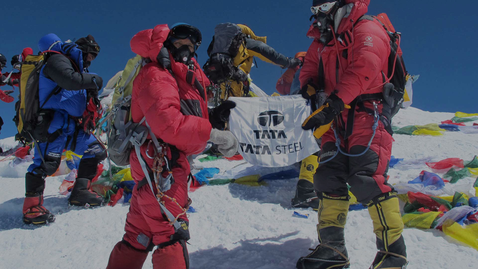 Premlata Agarwal holding the Tata Steel and Indian flags at the summit